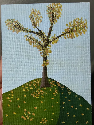 A tree with yellow leaves on a green hill Kevin painted