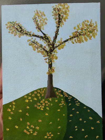 A tree with yellow leaves on a green hill Kevin painted